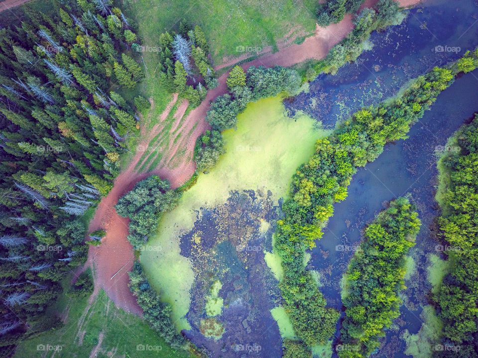 Aerial view of countryside landscape with river and forest