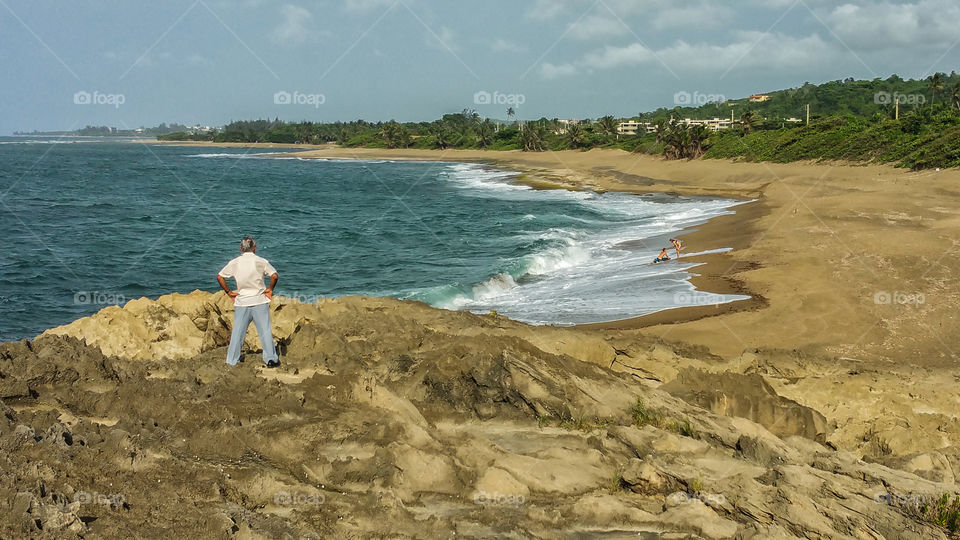 old man looking a young couple