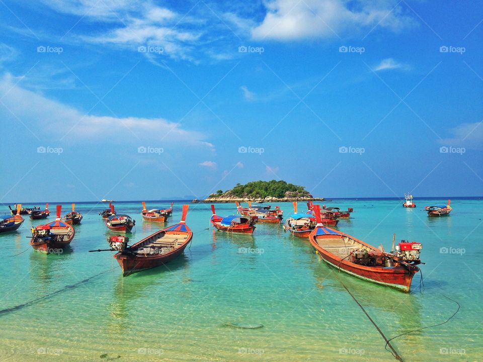 Small boats in the large sea. Lipe is a beautiful island in Thailand. 