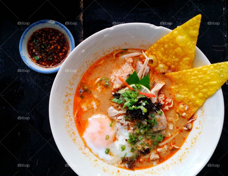 Sukhothai noodle tomyum, pork and eggs. Spicy and delicious food Thailand.