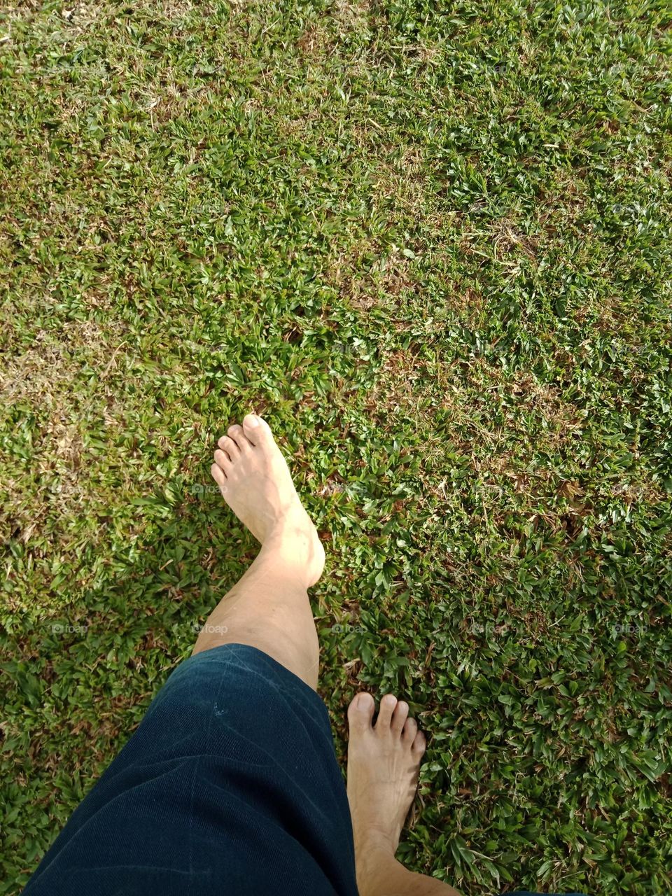 Bare feet on green