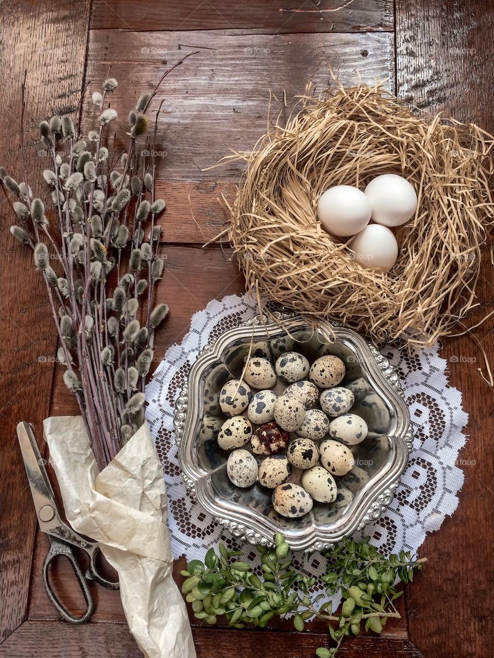 Easter composition of catkins and eggs on wooden table