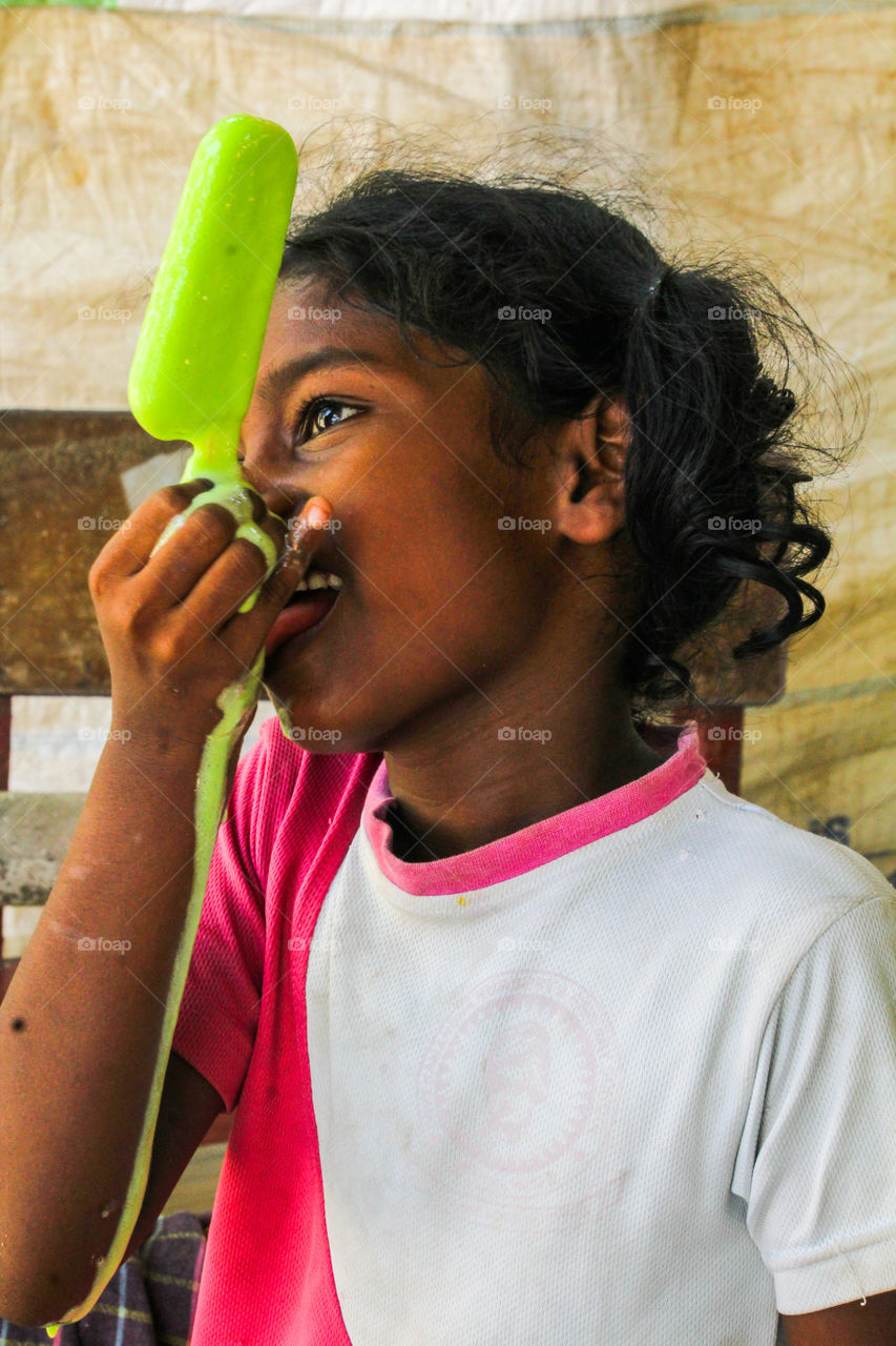 A happy story of village girl licking ice cream that melts down #sugar #sweet of love