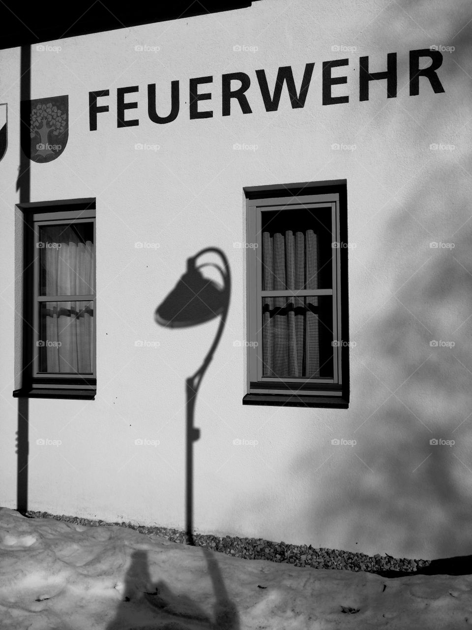 Shadow of street night light at the wall.