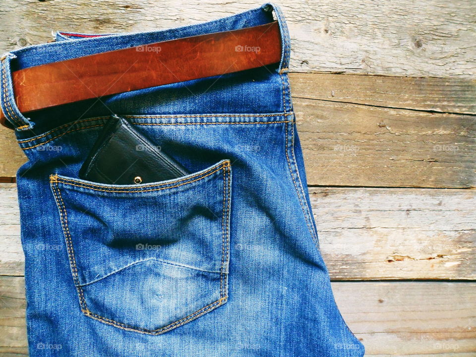 jeans lie on wooden boards