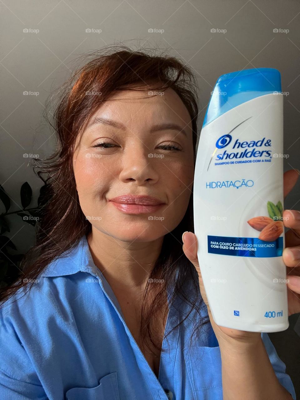 Woman showing shampoo