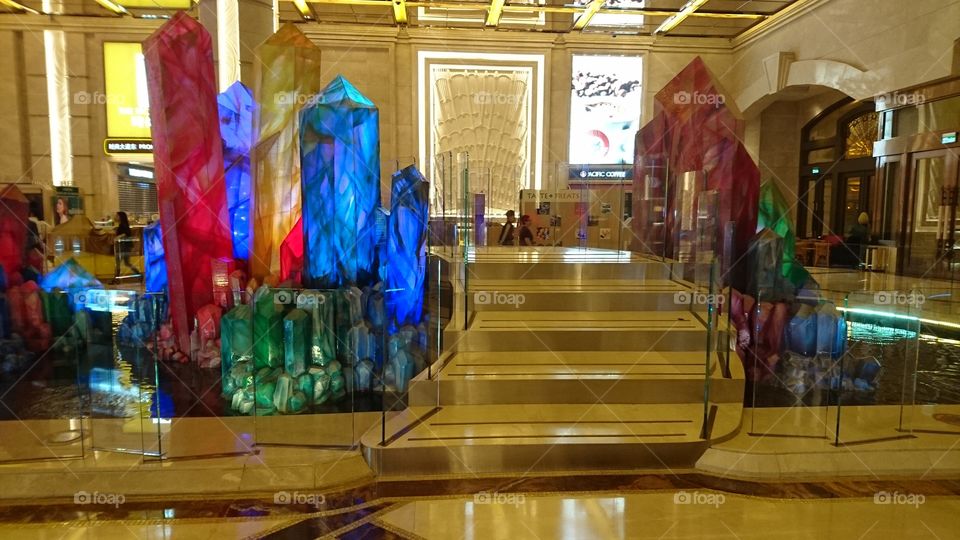 a different color of crystal design with a stairway surrounded the transparrent glass,
