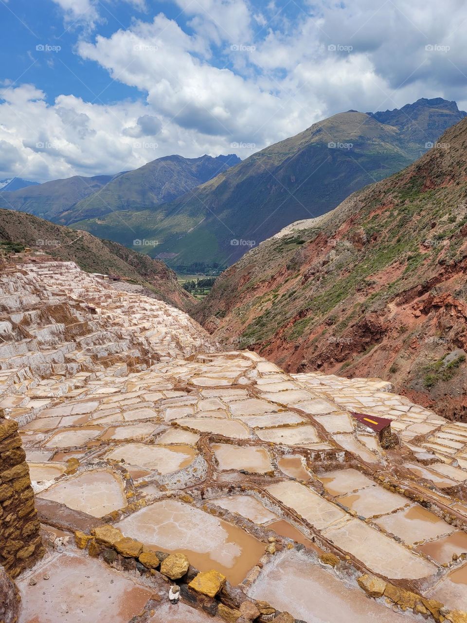 Peru is a destination for adventure lovers, with sacred world famous places and amazing culture and history. The photo shows a breathtaking view of the Andes from a salt production place called Maras.