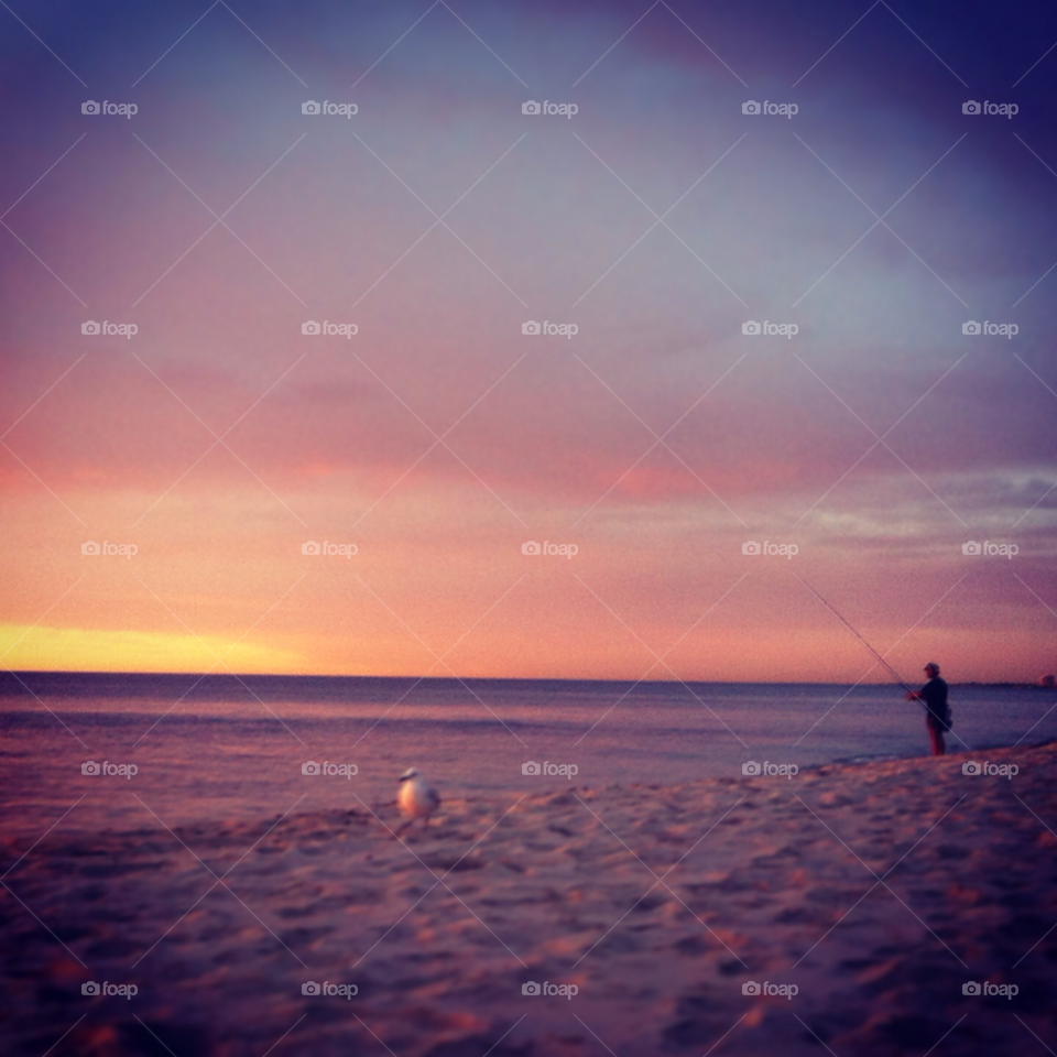 sunset seagull fisherman cottesloe by Naughtnaught