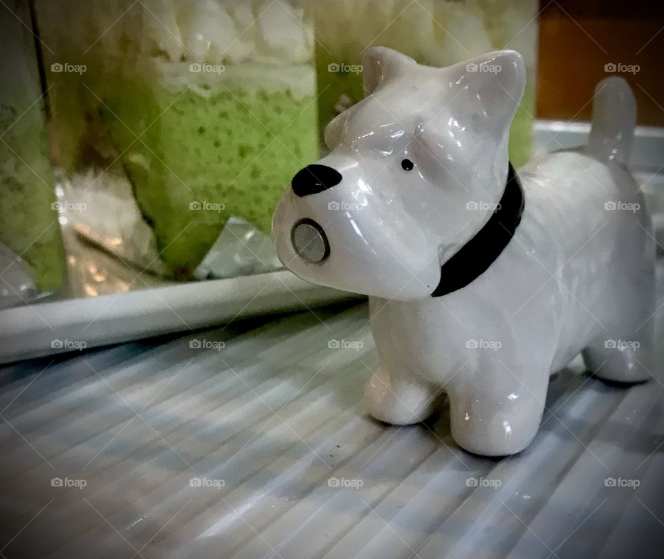 Coconut cake with a surprise porcelain dog 