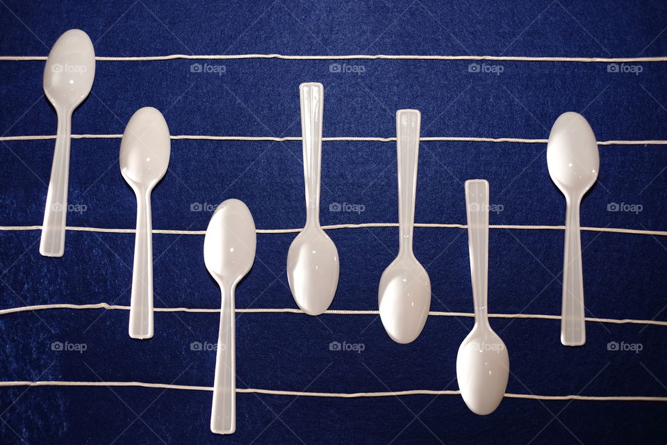 High angle view of plastic spoons