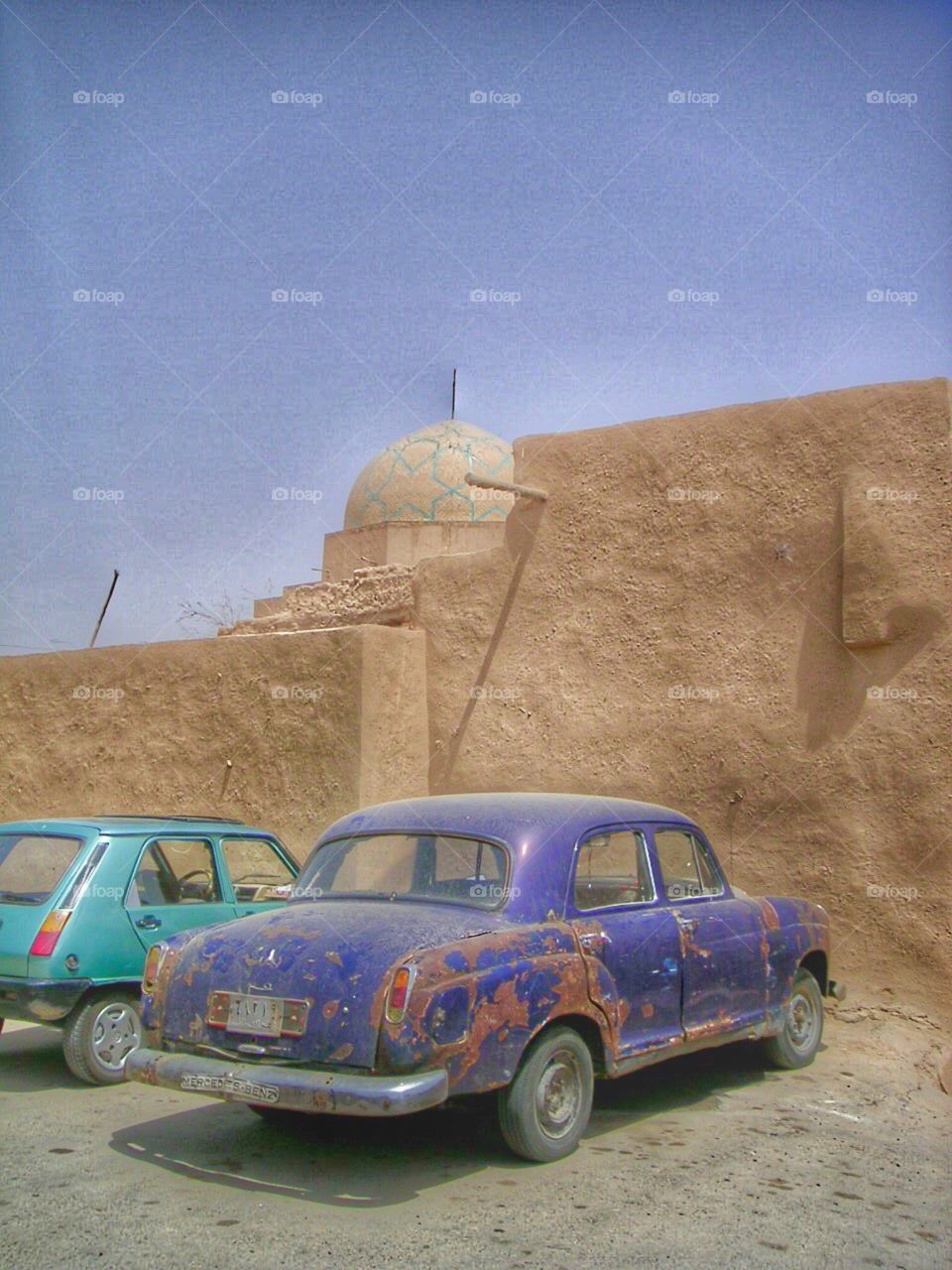Old car in iran parked outside 