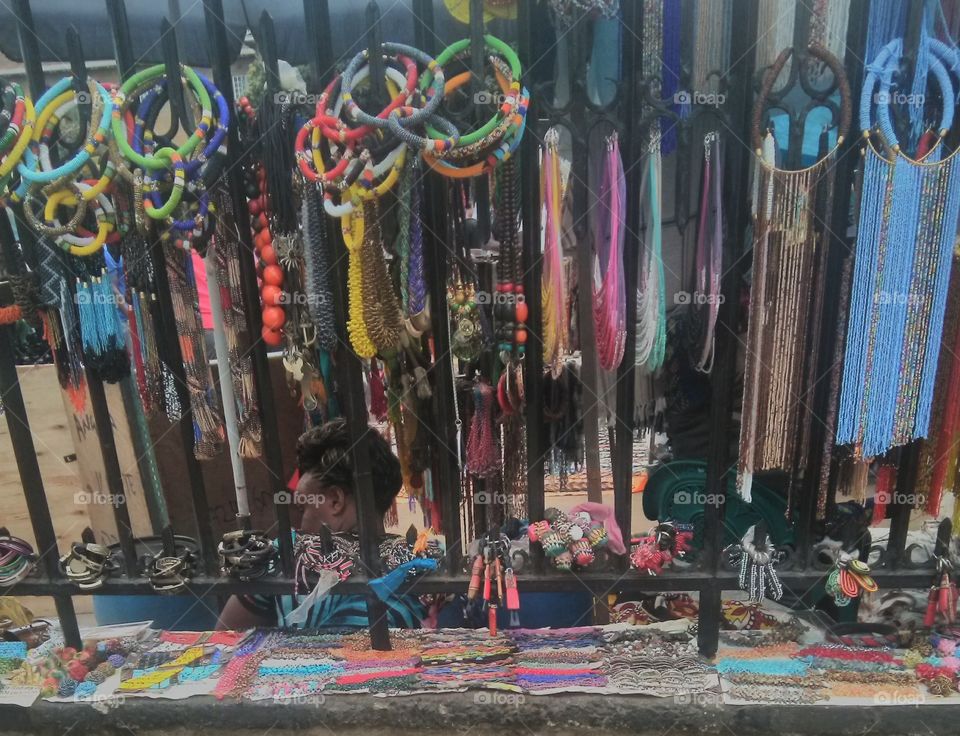 This photo shows beautiful African ornaments. They include necklaces, bracelets, anklets, key holders etc.