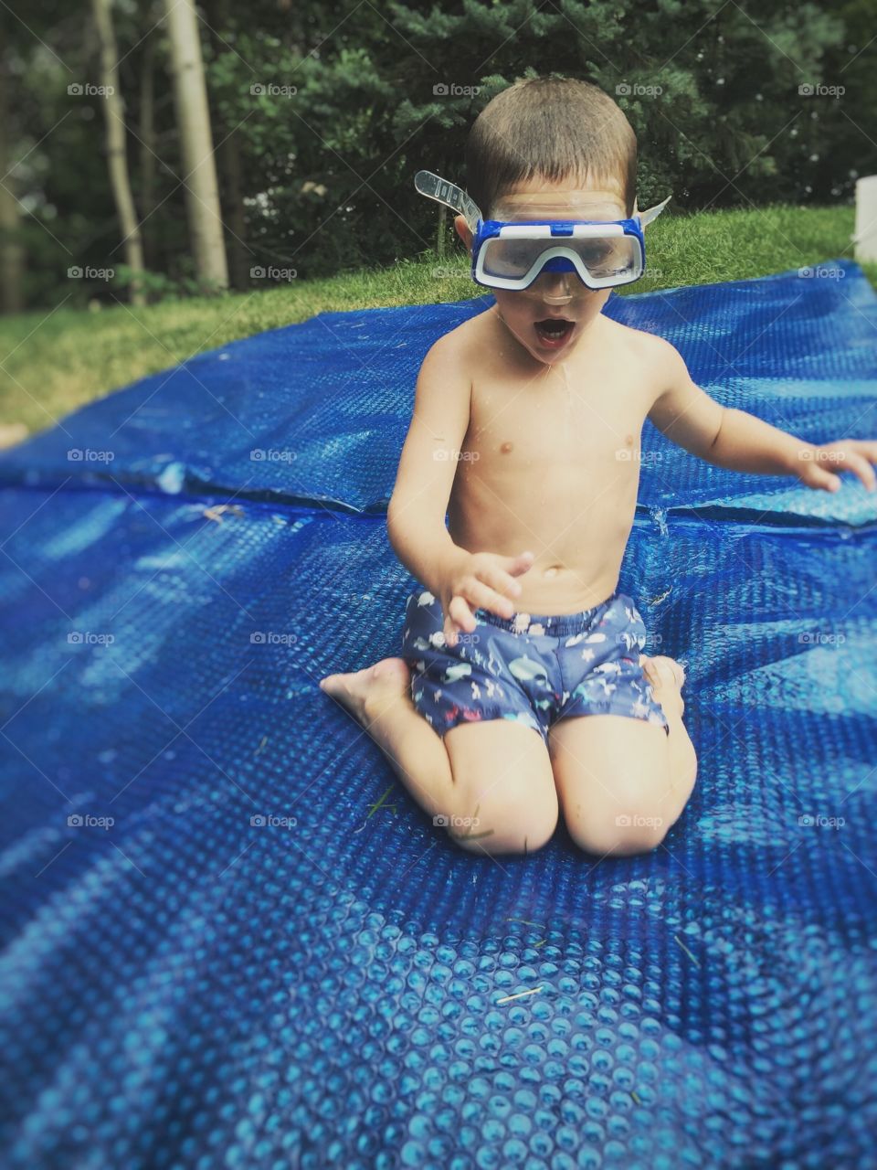 Boy wearing swimming goggles