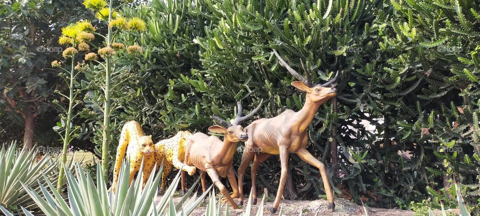 The statues of hunting Cheetahs and running deers.