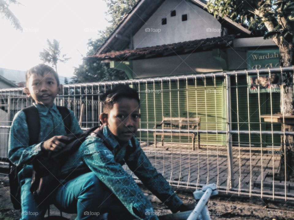 go to school together by bicycle. 