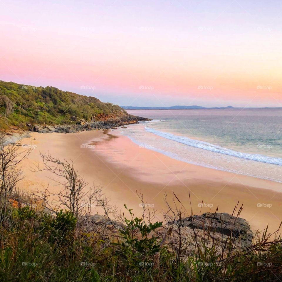 Pink skies in the morning light at the beach 