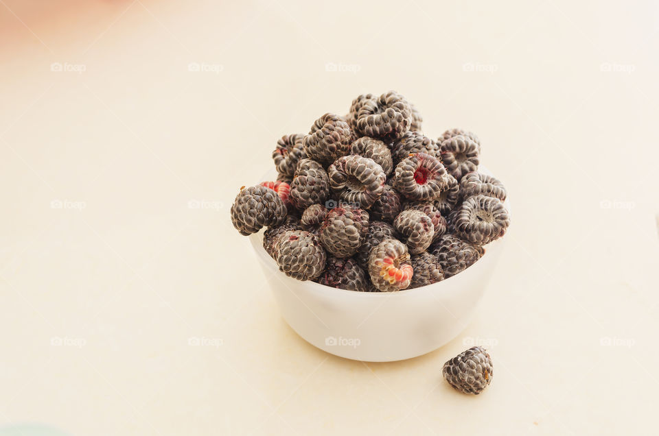 Black Raspberries In White Dish