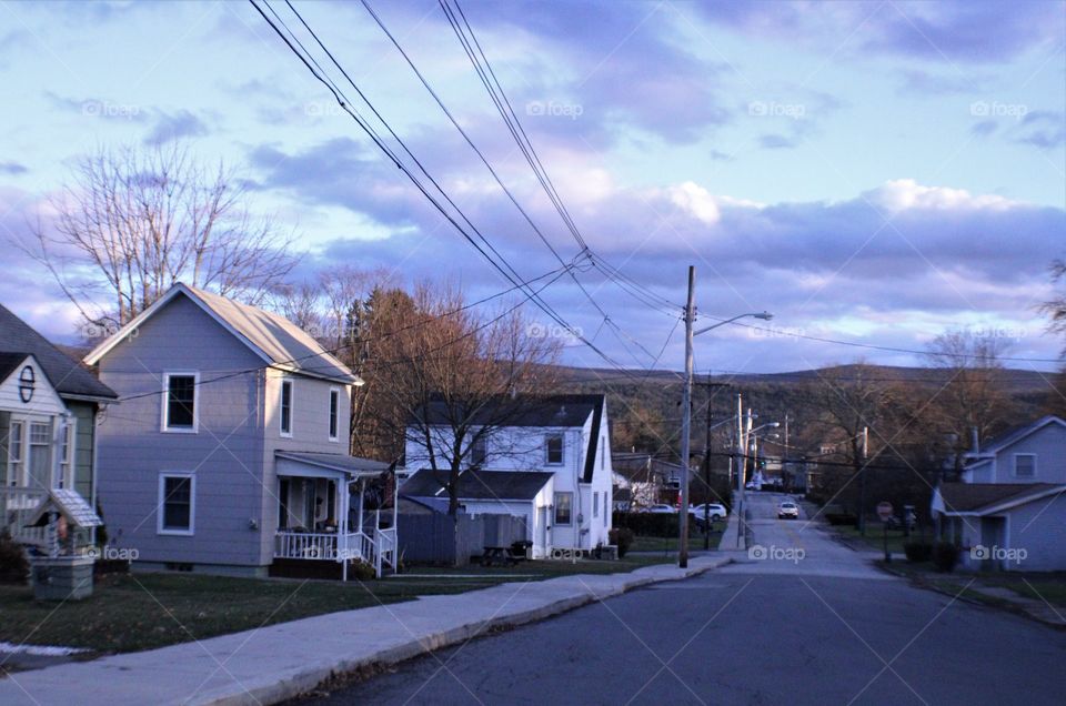 Road in Town With Mountains in the Background