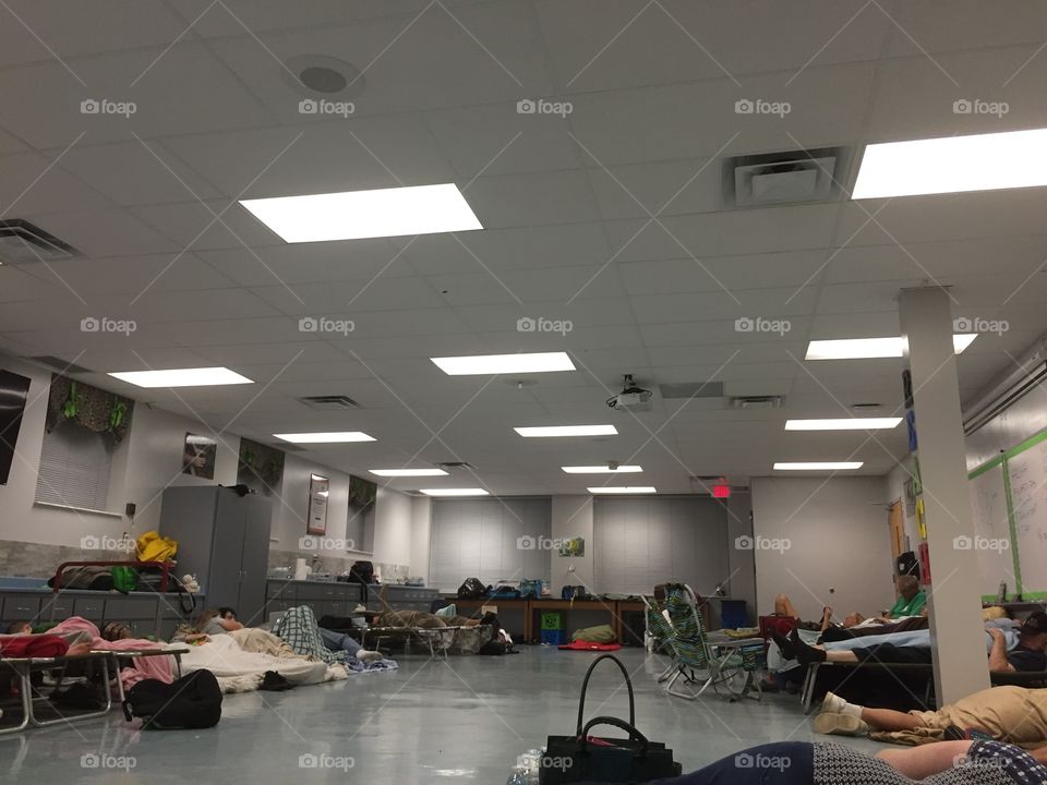 Evacuees take shelter in a school classroom during hurricane Matthew, in Bunnell, Florida.