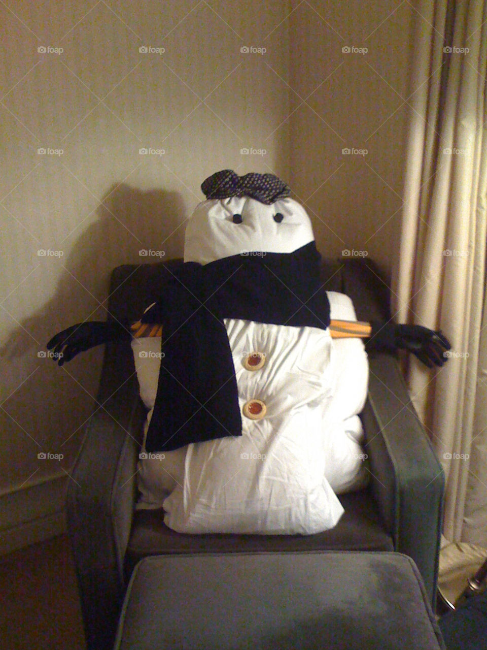 Building an indoor snowman made of pillows from our hotel room