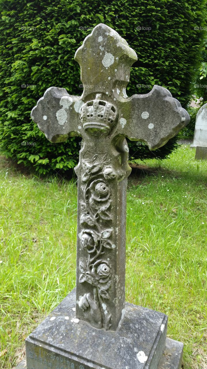 stone cross hand carved with roses.  120 years old grave

English cemetery 
100 + years old graves

Some people think graveyard and cemetery mean the same, but, if we want to be a little nitpicky, we should say that graveyard is a type of cemetery, but a cemetery is usually not a graveyard. To understand the difference, we need a little bit of history.

From about the 7th century, the process of burial was firmly in the hands of the Church (meaning the organization), and burying the dead was only allowed on the lands near a church (now referring to the building), the so-called churchyard. The part of the churchyard used for burial is called graveyard, an example of which you can see in the picture.

As the population of Europe started to grow, the capacity of graveyards was no longer sufficient (the population of modern Europe is almost 40 times higher than it was in the 7th century). By the end of the 18th century, the unsustainability of church burials became apparent, and completely new places, independent of graveyards, were devised—and these were called cemeteries.

The etymology of the two words is also quite intriguing. The origin of "graveyard" is rather obvious; it is a yard filled with graves. However, you might be surprised to hear that "grave" comes from Proto-Germanic *graban, meaning "to dig", and is unrelated to "gravel".

Of course, the word "cemetery" did not appear out of the blue when graveyards started to burst at the seams. It comes from Old French cimetiere, which meant, well, graveyard. Nevertheless, the French word originally comes from Greek koimeterion, meaning "a sleeping place". Isn't that poetic?