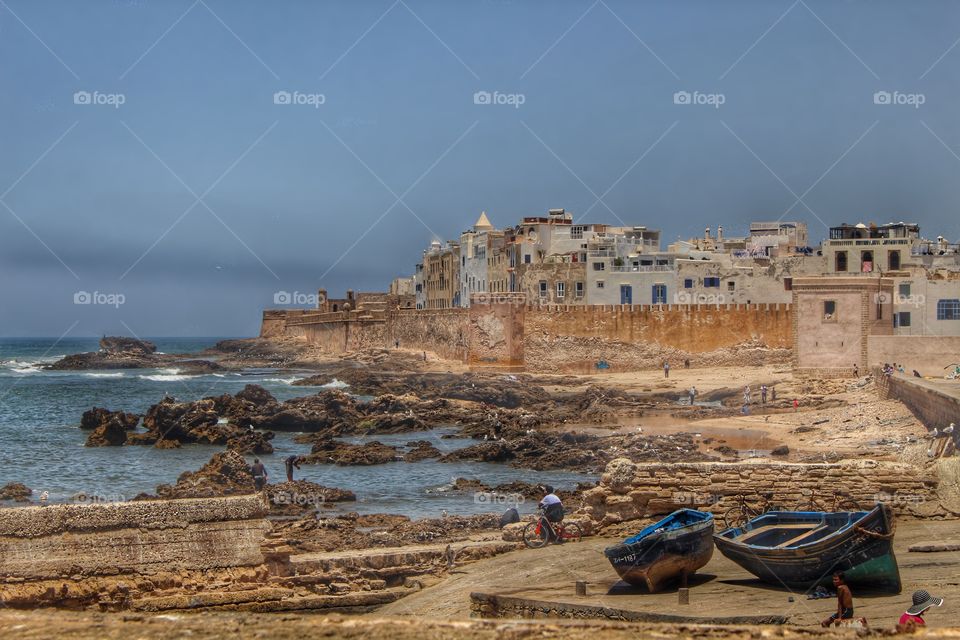 Essaouira, Morocco . A view of the city walls of Essaouira with fishing boats.