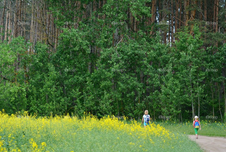 family mother and child walking outside view from the ground