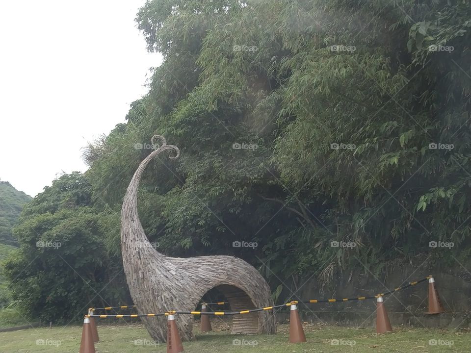 an art of beautiful a dolphin hay straw structure in the mountain.
