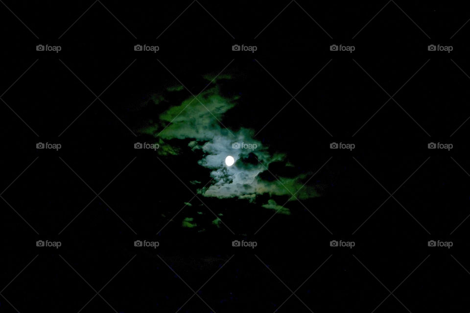 Moon shinning through clouds