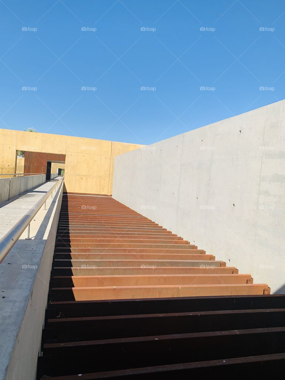 Rusted metal and concrete wall on the roof top of a resort. 