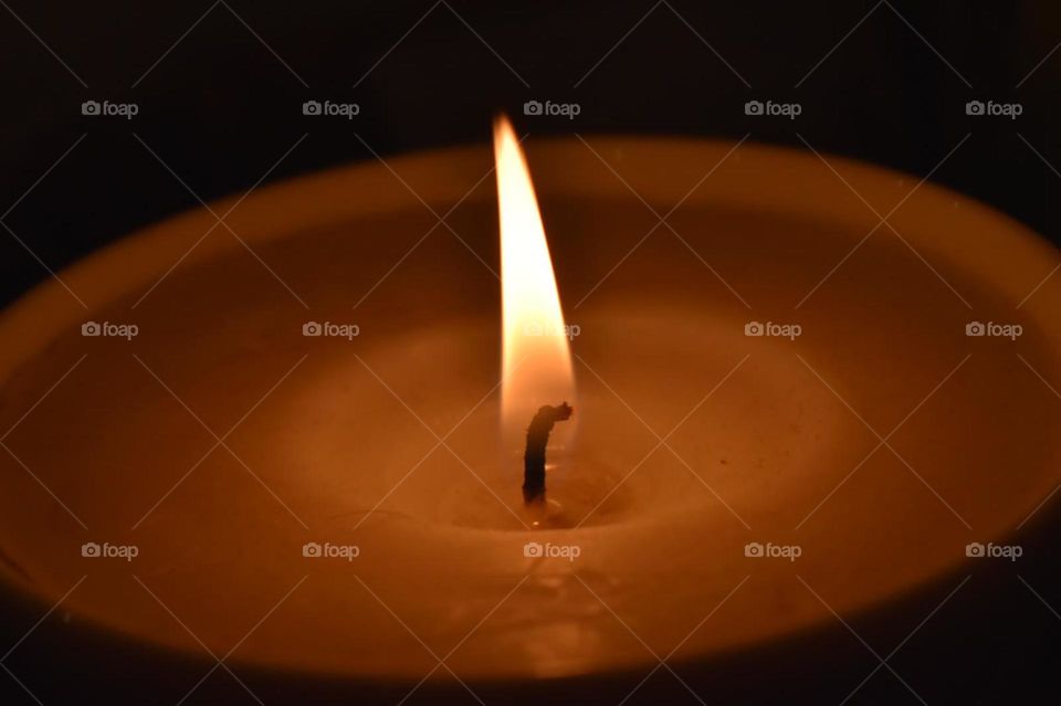 A warm candle flame