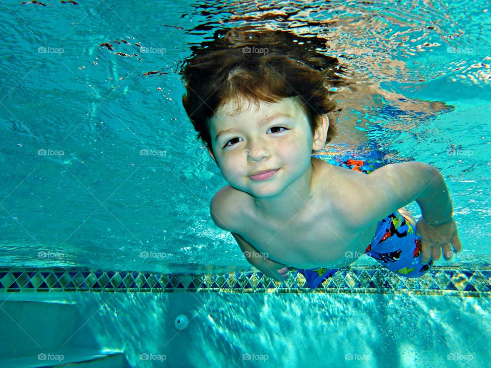 Child swimming in underwater