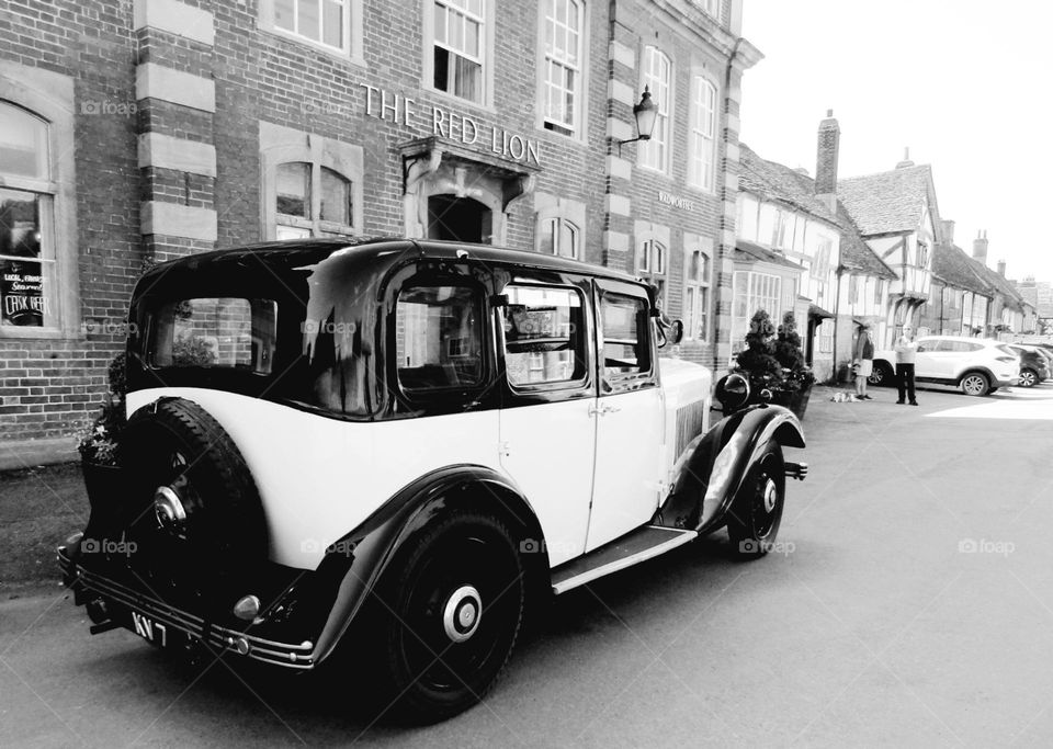 black and white photo of a vintage car
