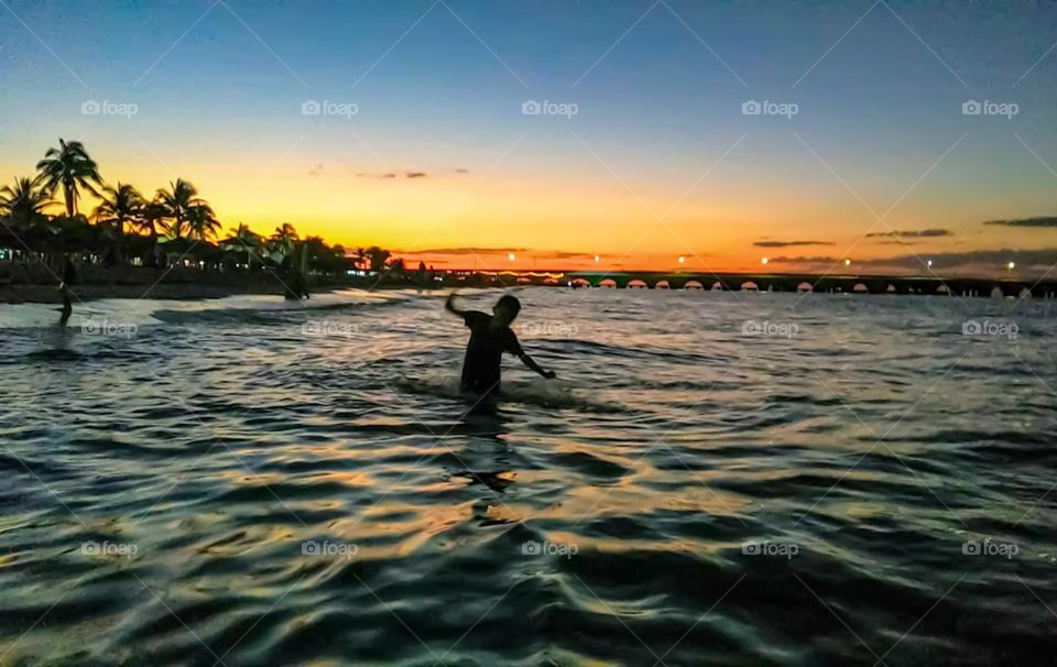 boy playing on the beach in the afternoon