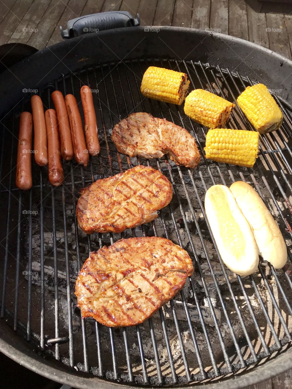 Meat,sausage and sweet corn on the grill