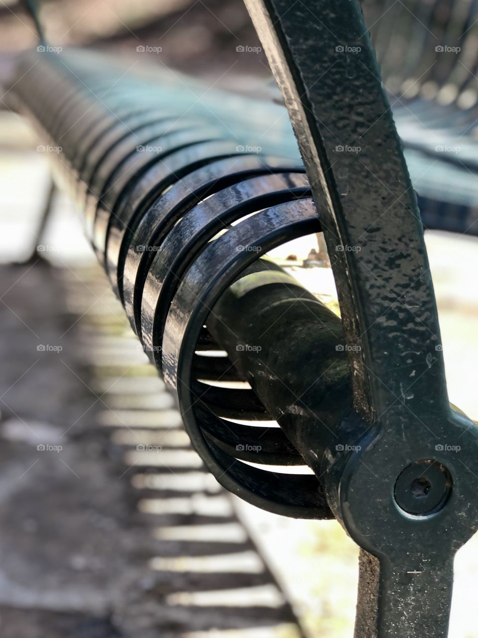 Green metal park bench 