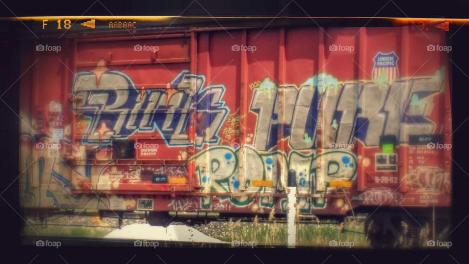 Tagging graffiti on a rail car along the CNN railroad line in Wyandotte, MI