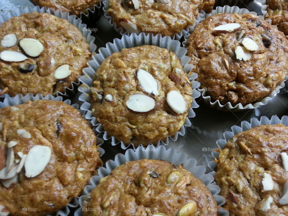 Morning Glory Muffins. Freshly baked morning glory muffins topped with a
lmonds