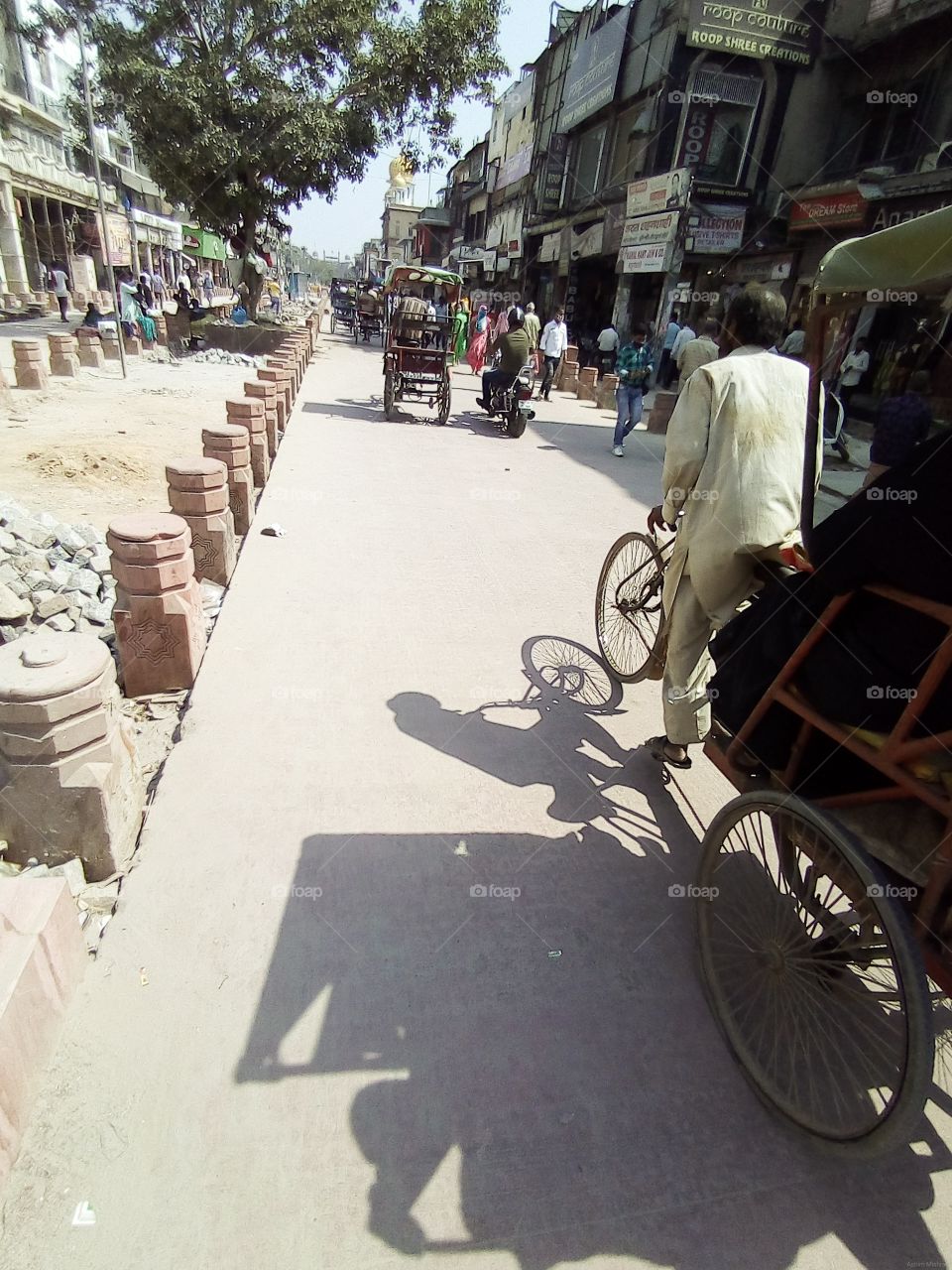 A hard-working man pulling rikshaw in chandni chowk.