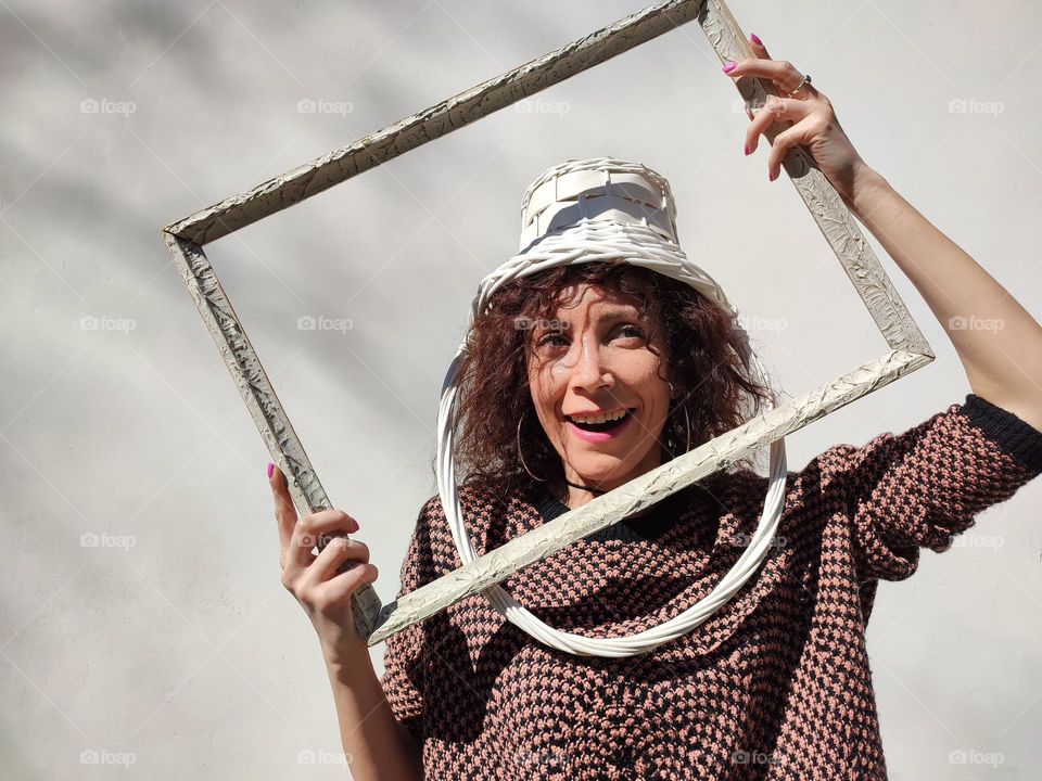 Funny Portrait of Young Woman Posing With Basket on Head, Smiling with Happy Face