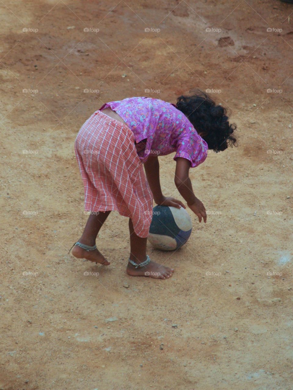 A young person having fun with a soccer ball
