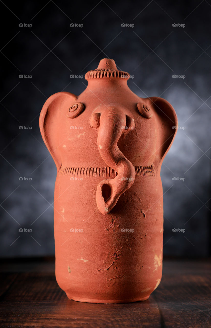 Indian God Ganesha handmade pottery figurine