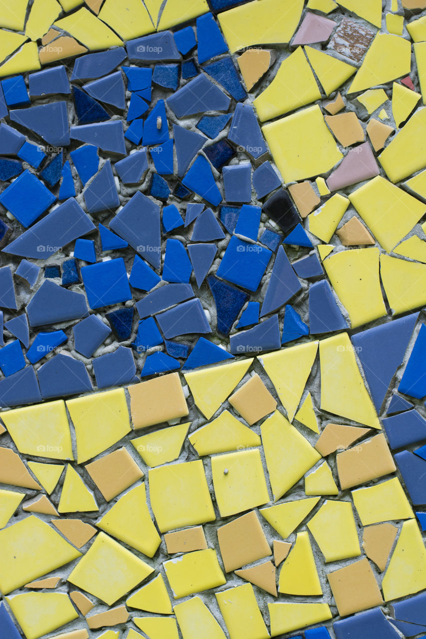 Colorful tiles of blues and yellow balanced geometric 