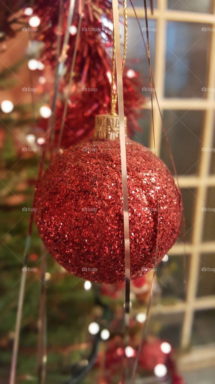 Christmas bauble hanging on a Christmas tree