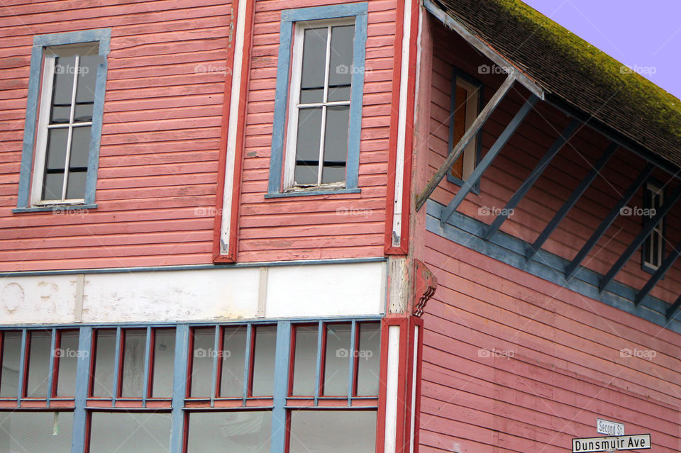 A pink and blue historic wooden building in an old coal mining town with a rich history. 