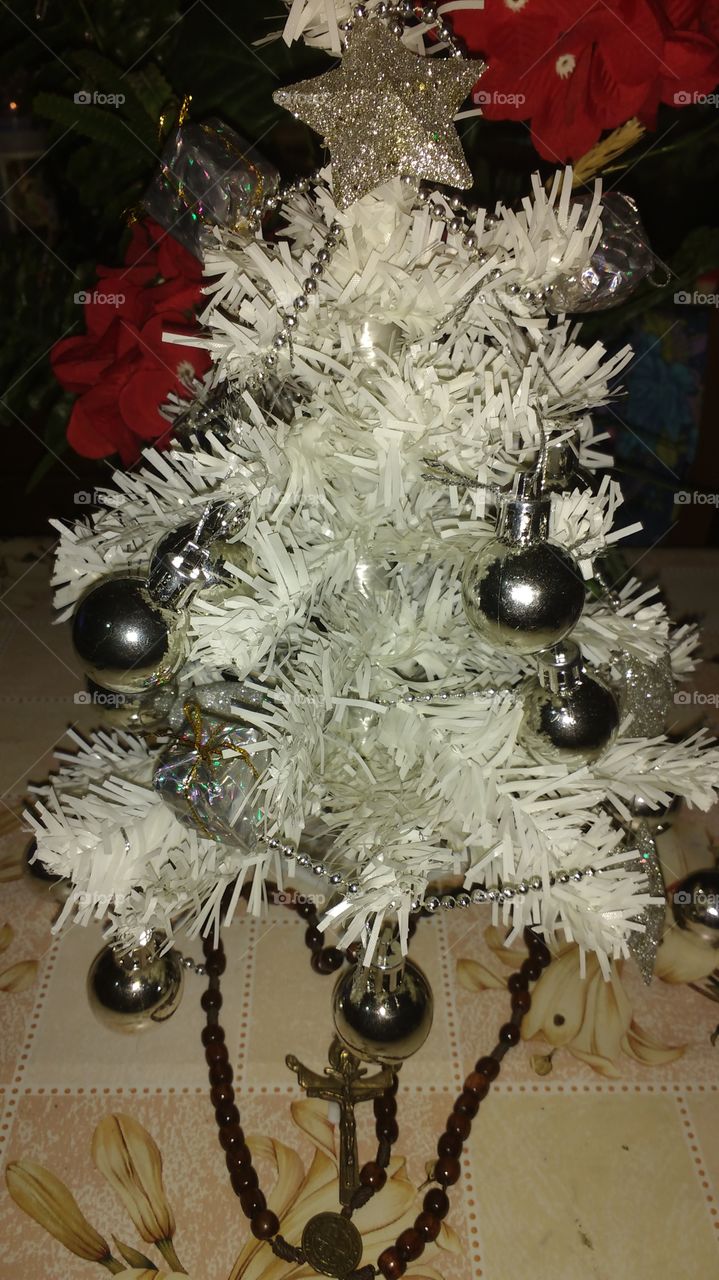 White christmas tree with silvery balls.