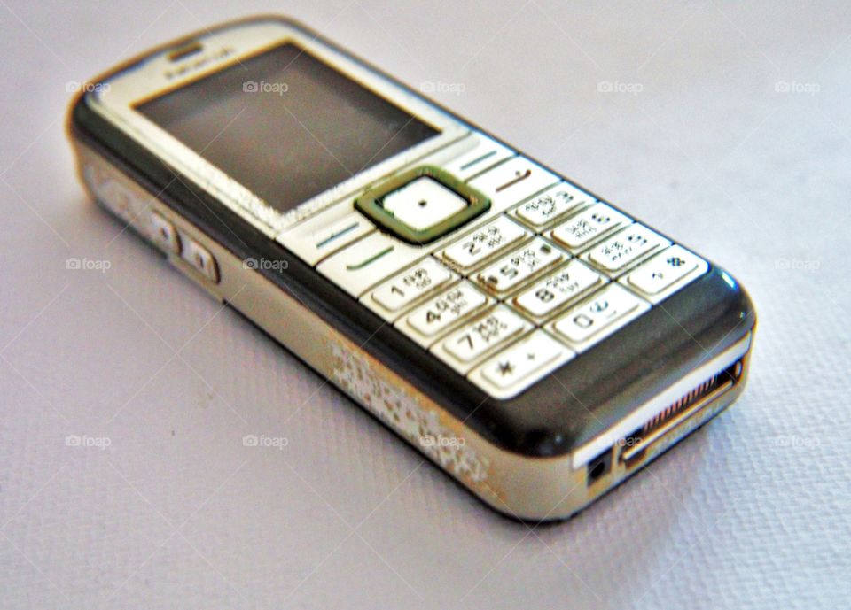 Old mobile phone on white background