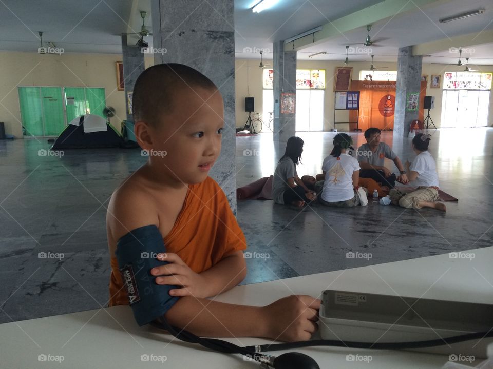 Monk getting his blood pressure at camp