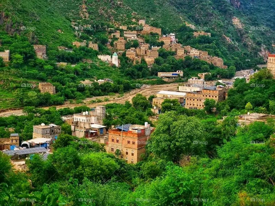 A stunning view of green mountains covered in fog in Yemen